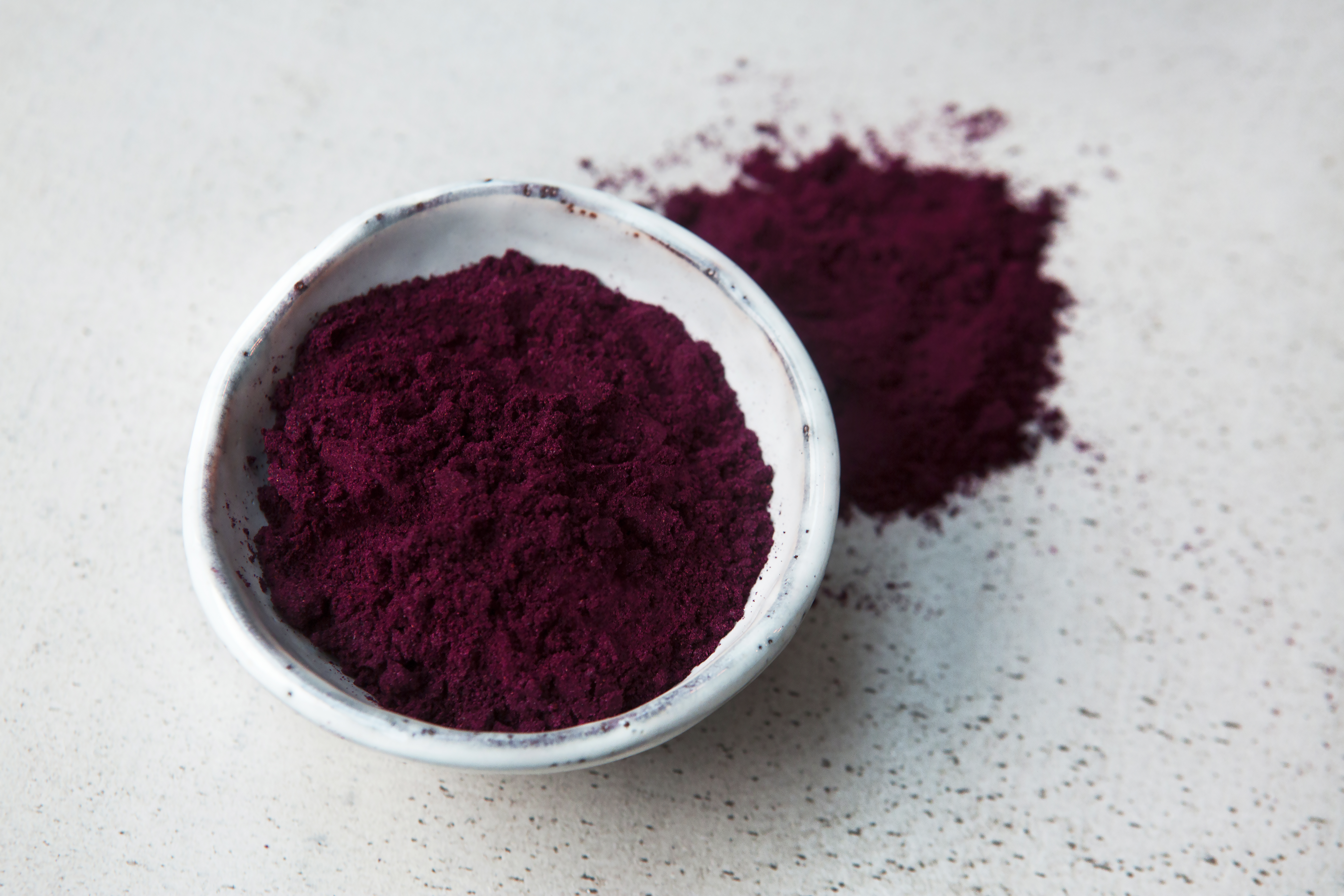 purple haskap berries powder in a bowl